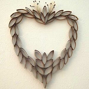 A heart decoration made from recycled toilet paper tubes.
