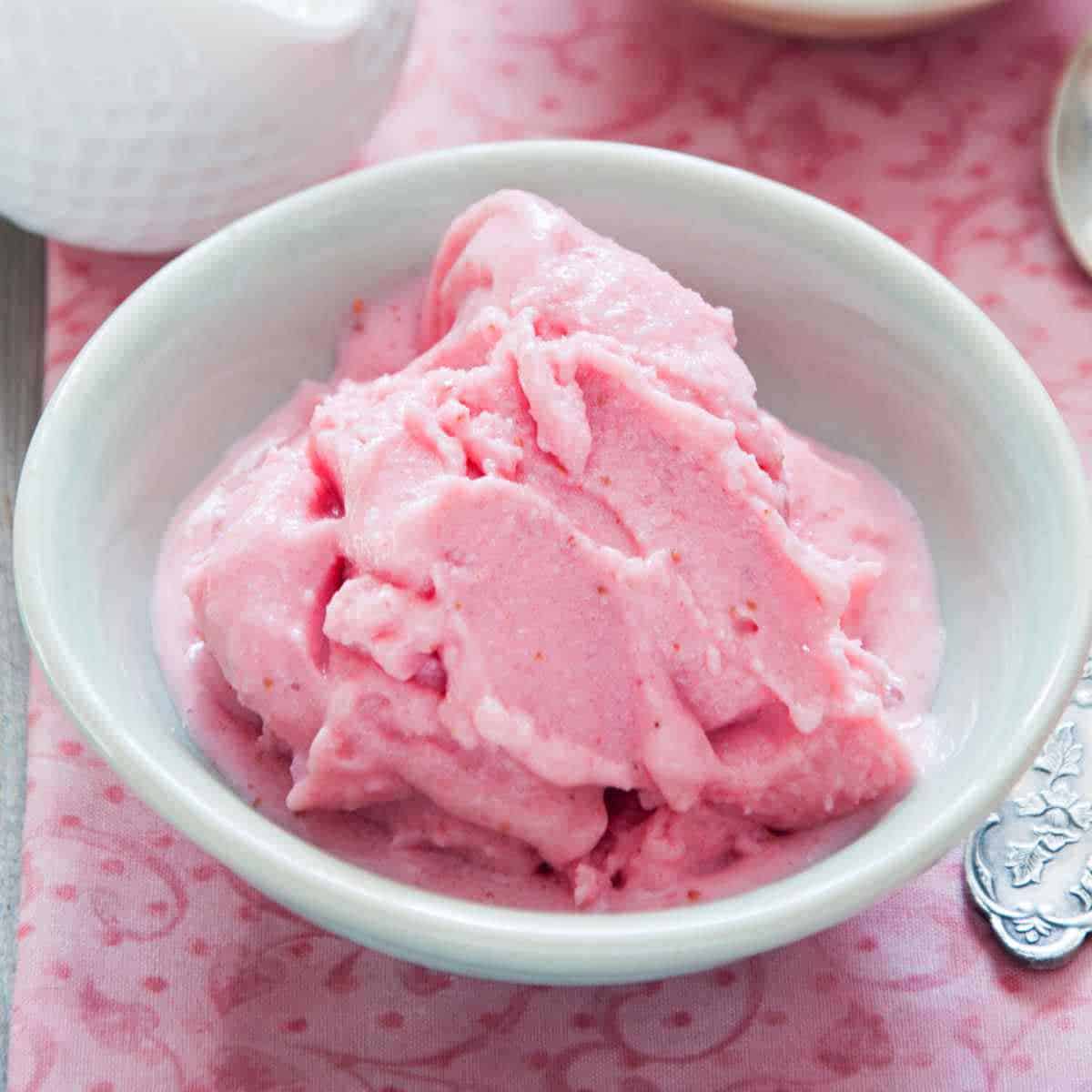 Homemade frozen yogurt in a white bowl.