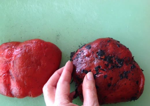 Remove the blackened skin from a roasted pepper with your fingers
