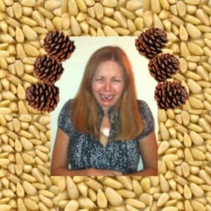 A background of pine nuts, and a photo of the author grimacing.
