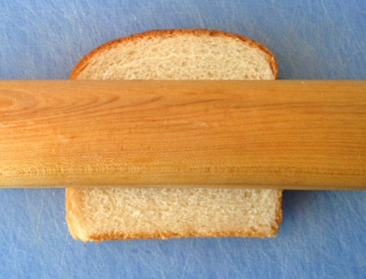 Roll bread flat for Cinnamon Crispies.