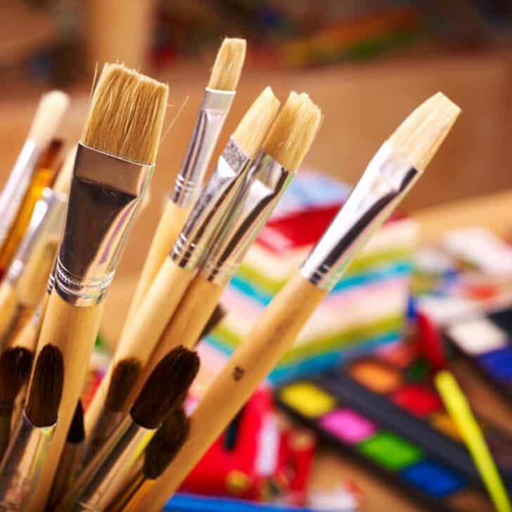 paint brushes and watercolor paints.