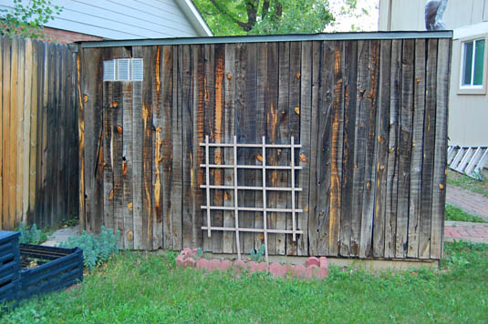 Tool shed covered with reclaimed fencing | Happy Simple Living blog