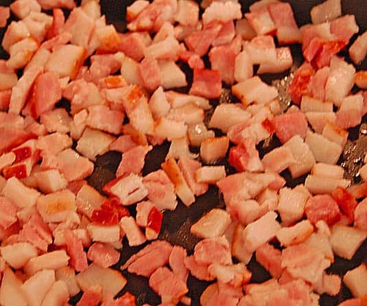 frying chopped bacon