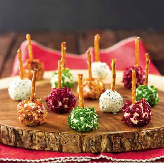 baby cheese balls on a wood platter.