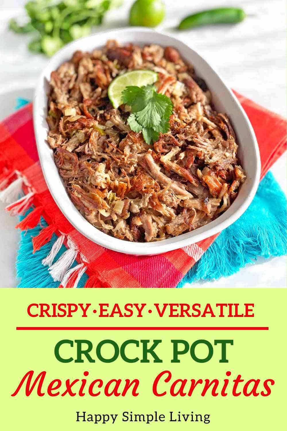 Crock Pot Mexican Carnitas in a white serving dish with fresh lime wedges.
