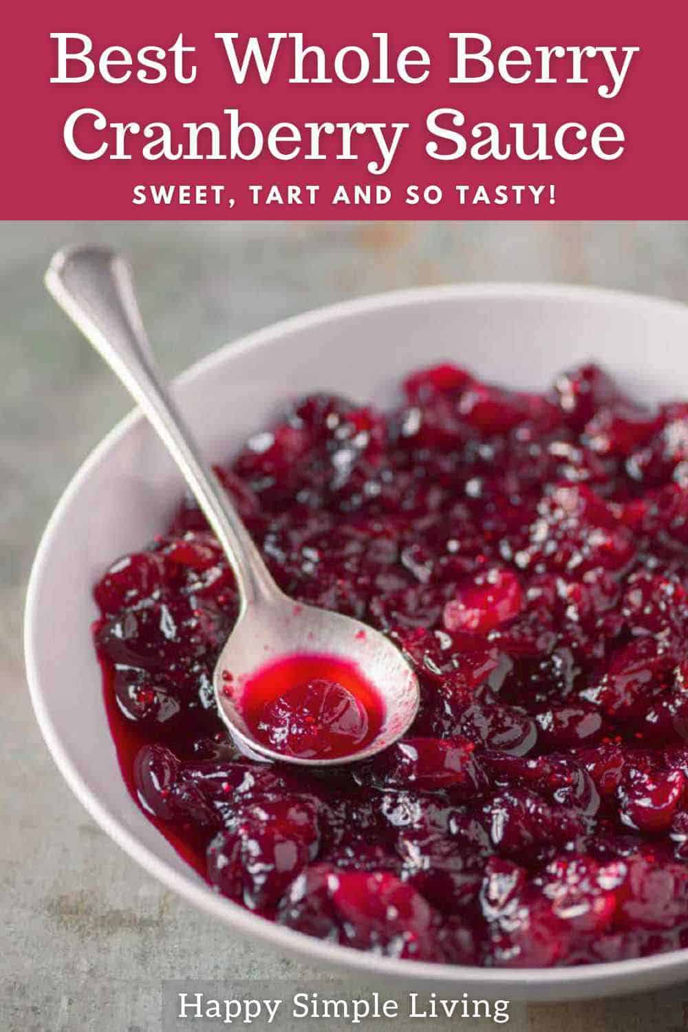 Cranberry sauce in a bowl with a serving spoon.