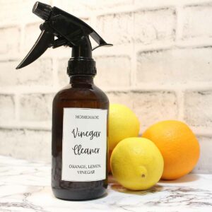 Finished orange and lemon peel vinegar cleaner in a spray bottle with a printed label.