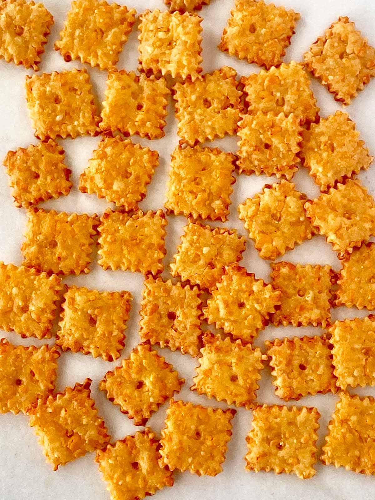 Close up of baked homemade cheez it crackers.