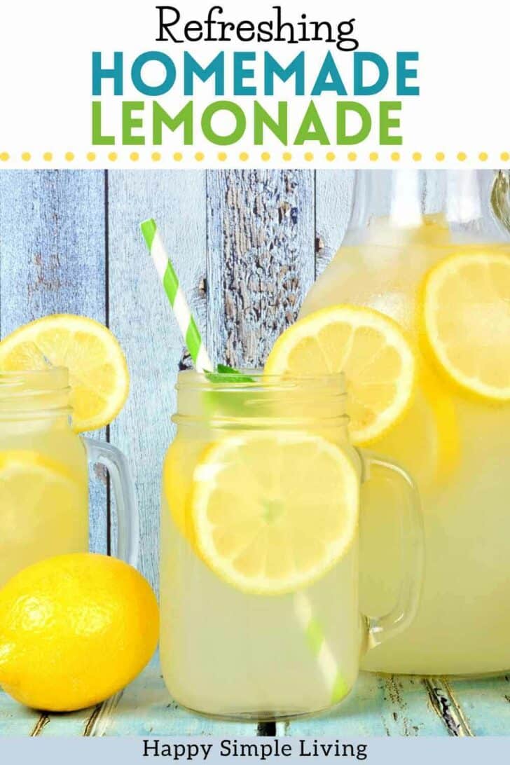 A glass and a pitcher of homemade lemonade with lemons.