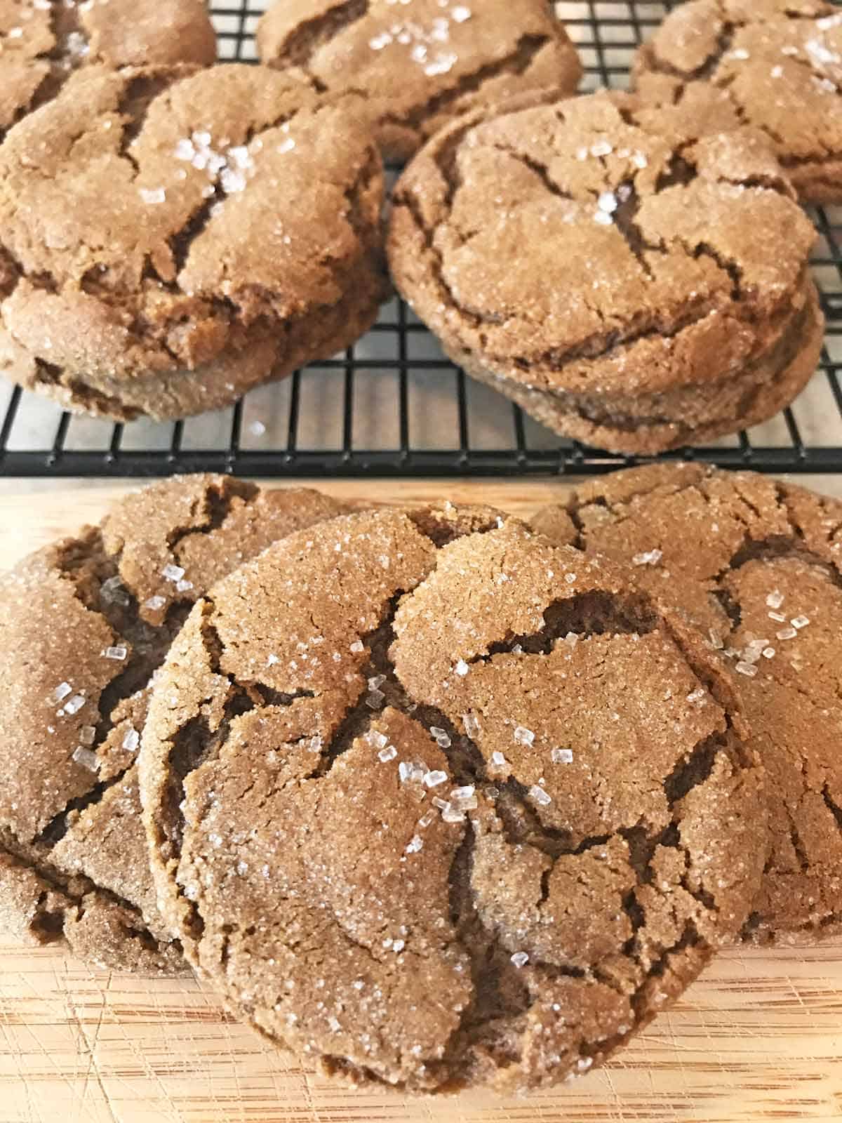 Molasses ginger cookies on a cooling rack.