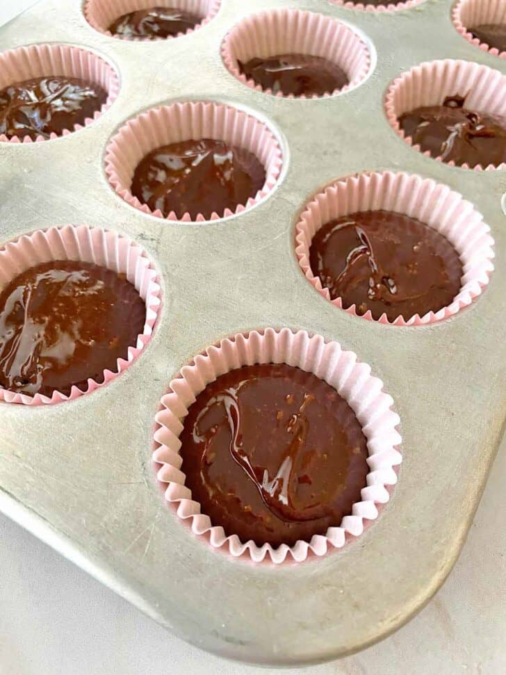 Unbaked mini chocolate cakes ready to be put in the oven.