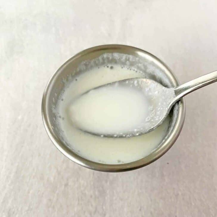 combining milk and yogurt in a small bowl.