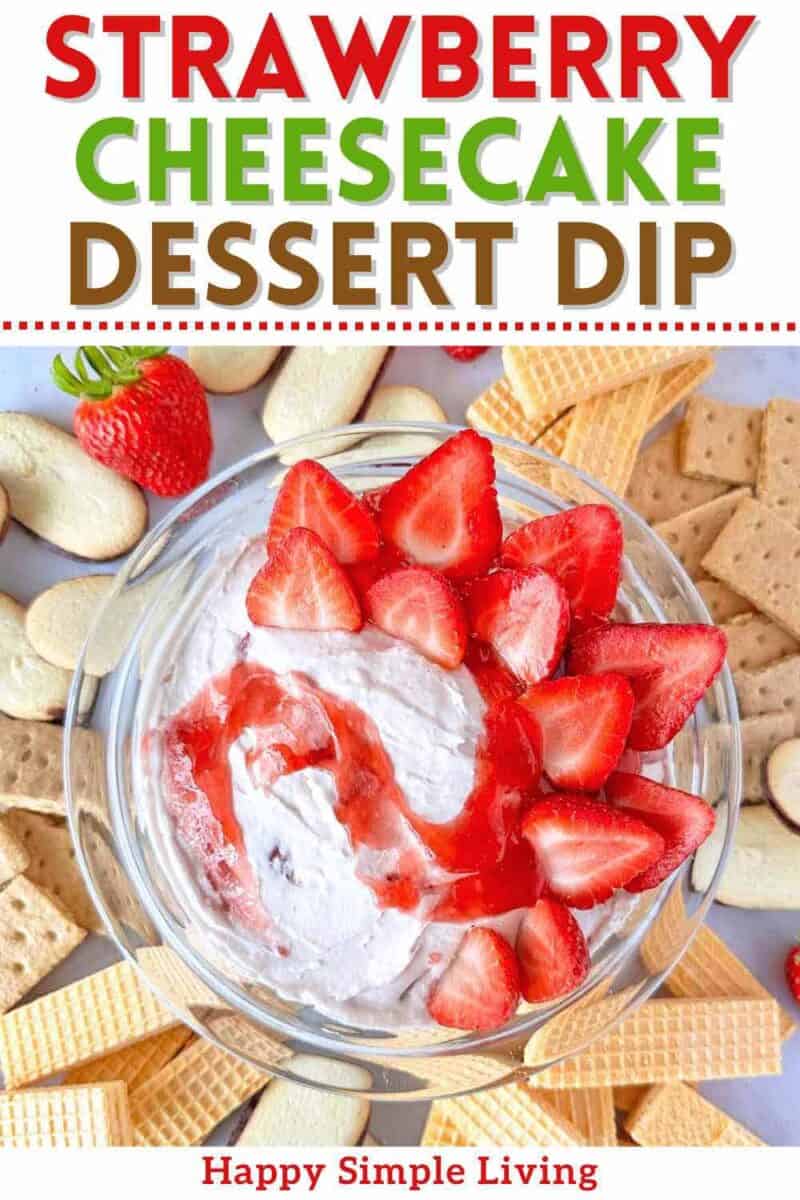 A bowl of strawberry cheesecake dessert dip surrounded by cookies.