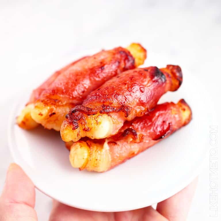 Bacon Wrapped Halloumi Cheese on a small white plate.