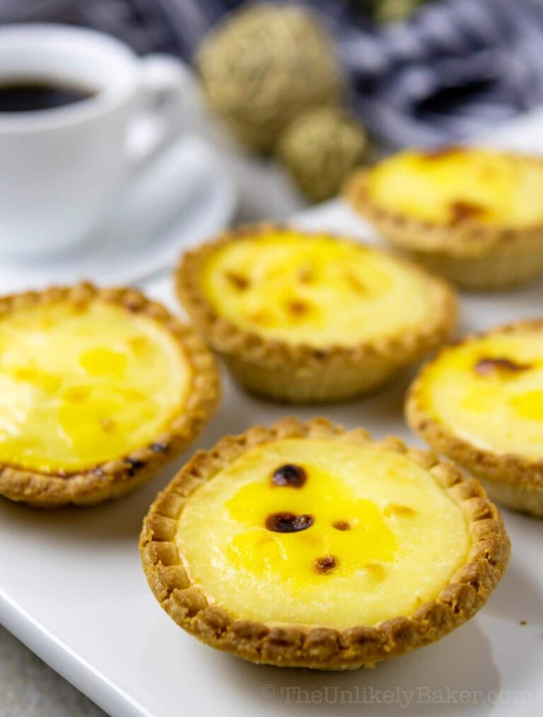 Five hokkaido cheese tarts on a white serving tray.