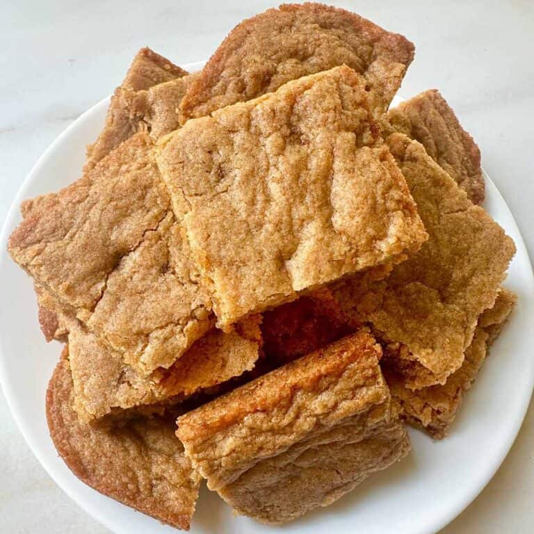 A batch of butterscotch cookie bars on a white plate.