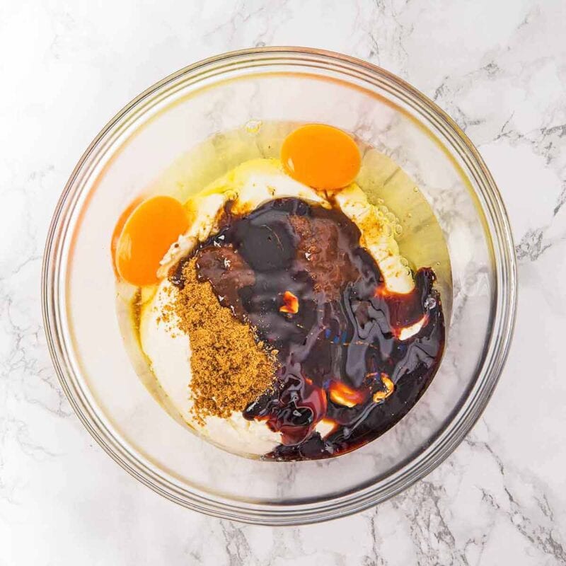 Ginger cheesecake ingredients in a mixing bowl before mixing together.