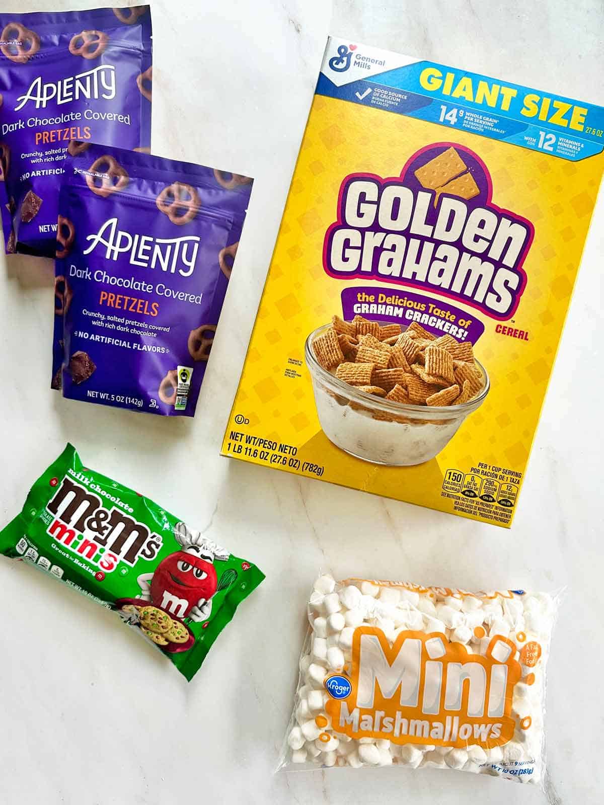 Chocolate covered pretzels, Golden Grahams cereal, mini marshmallows, and colorful m&m candies.