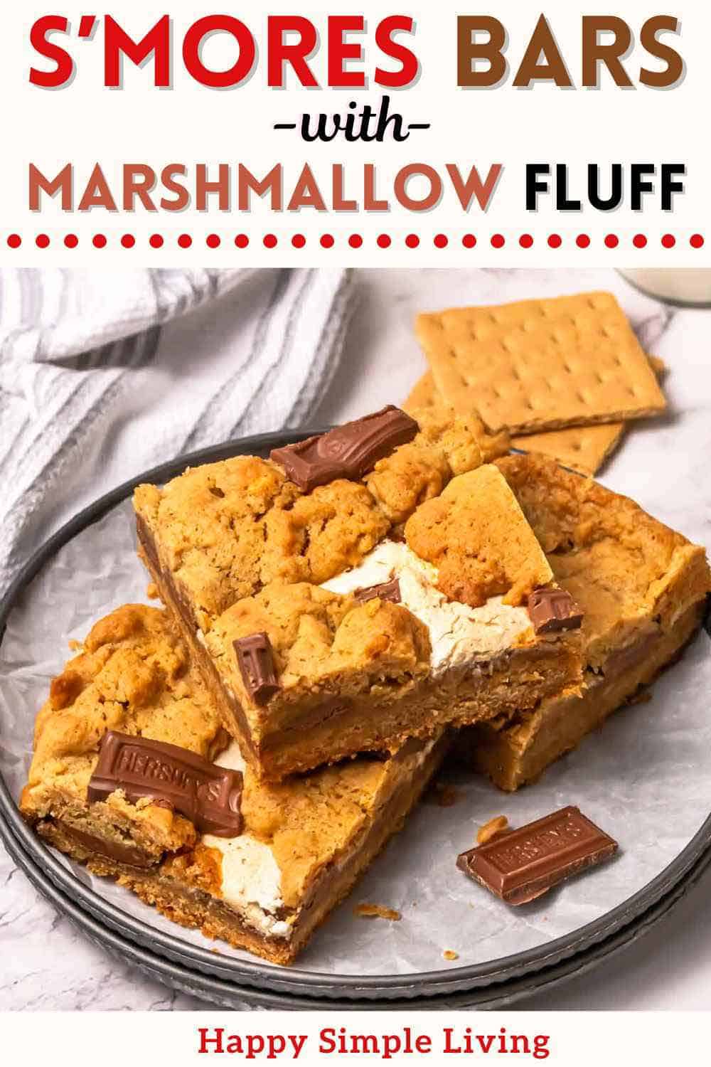 Three s'mores bars, two graham crackers, and a striped dish towel.