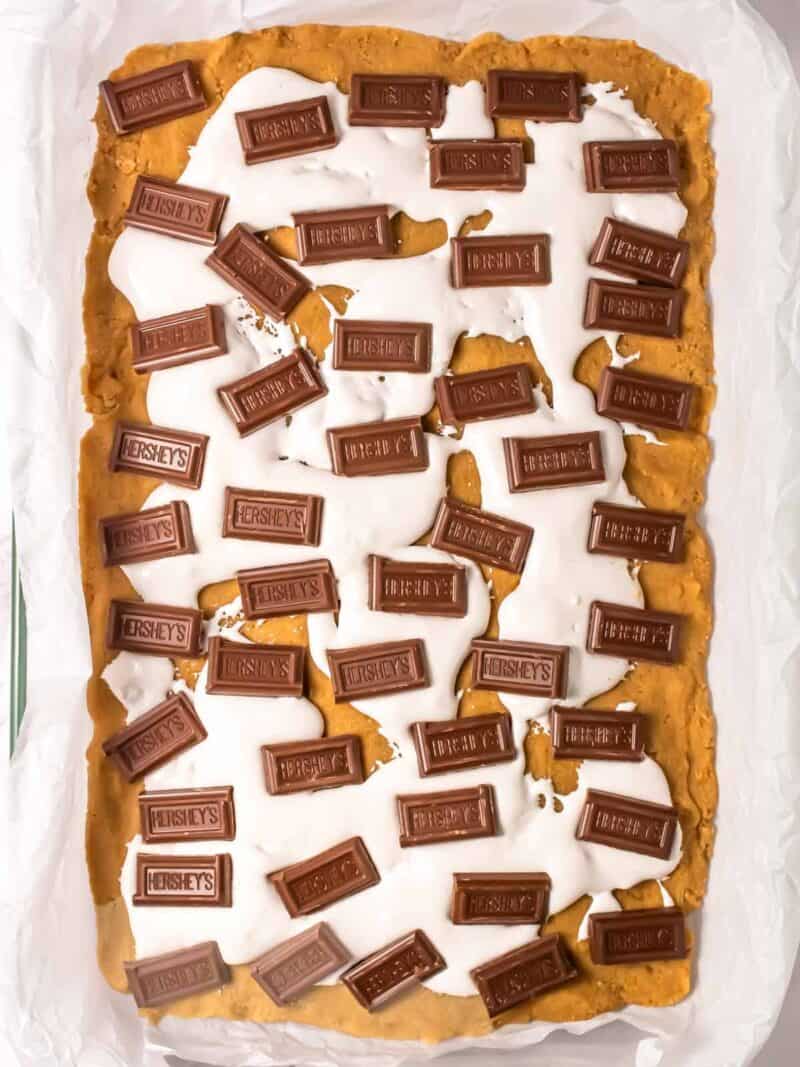 Chocolate bars topping the s'mores bars.