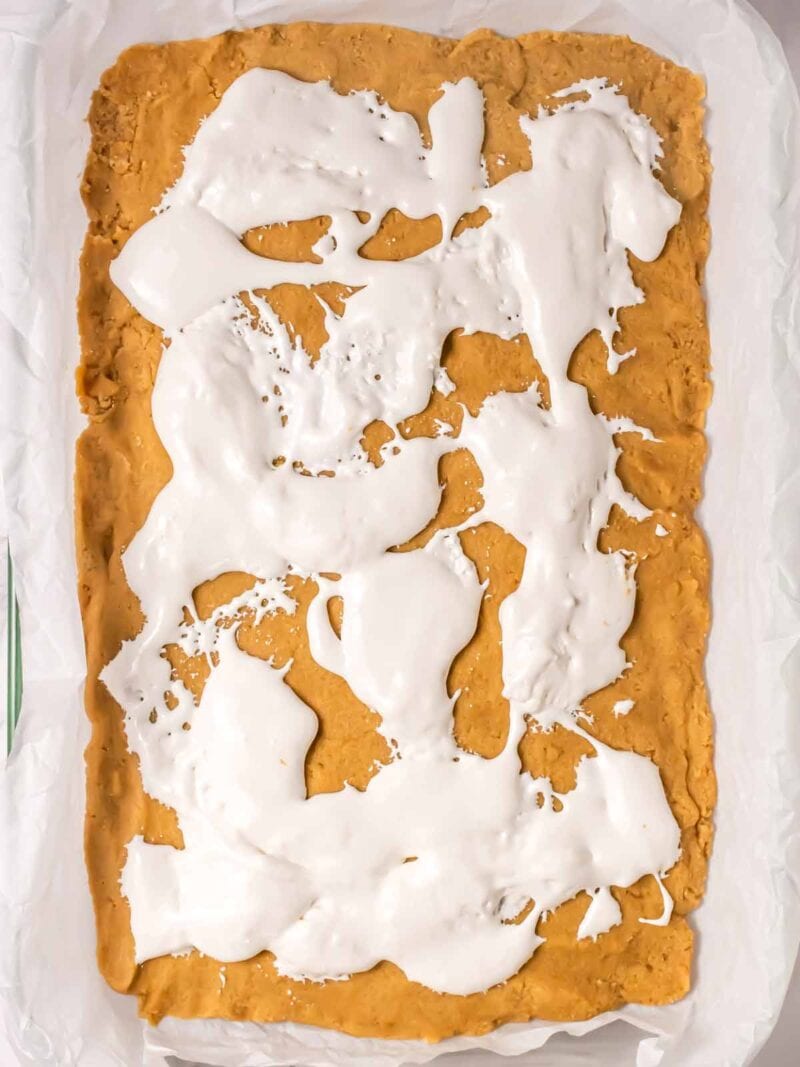 Marshmallow fluff layer on top of Smores cookie bars.