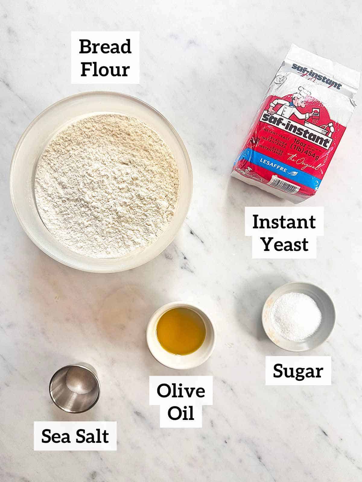 Bread flour, instant yeast, sugar, olive oil, and sea salt to make New York style pizza from home.